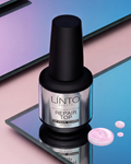 Linto Beauty nail polish bottle with a black cap on a reflective surface