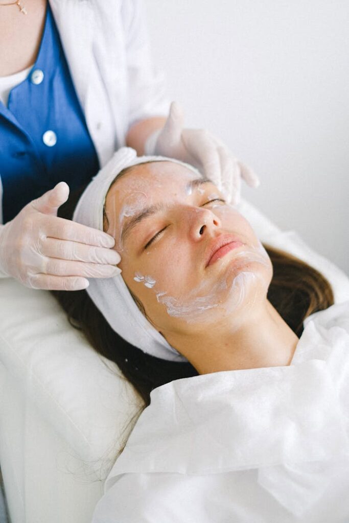 pexels photo 5069493 Woman receiving a facial treatment at a spa, promoting skin health and relaxation.