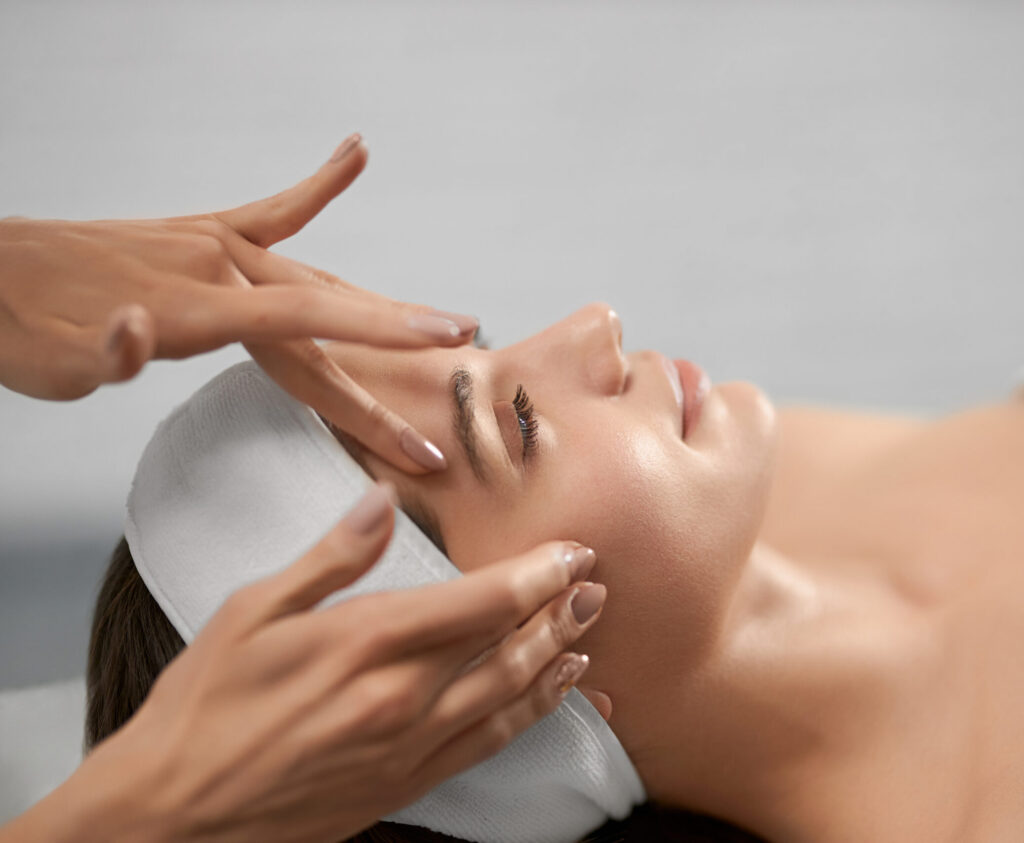 smiling young woman on procedure for face. smiling young woman on procedure for face.